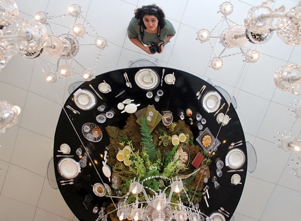 view looking down at a woman and a table display