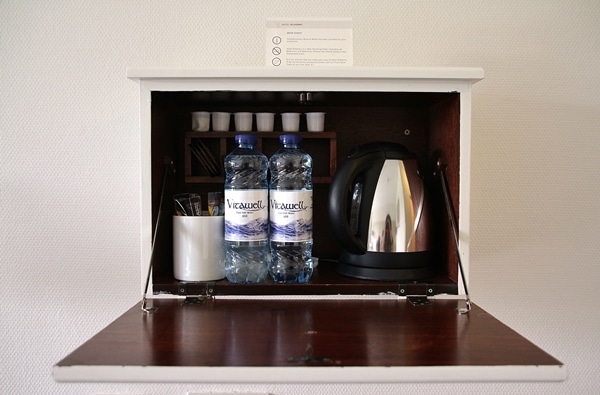 a coffee pot and bottled waters