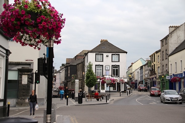 A close up of a quiet street with flowers