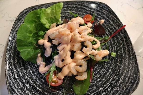a salad with small shrimp