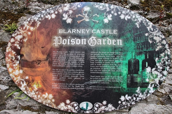 A close up of a sign that says Poison Garden