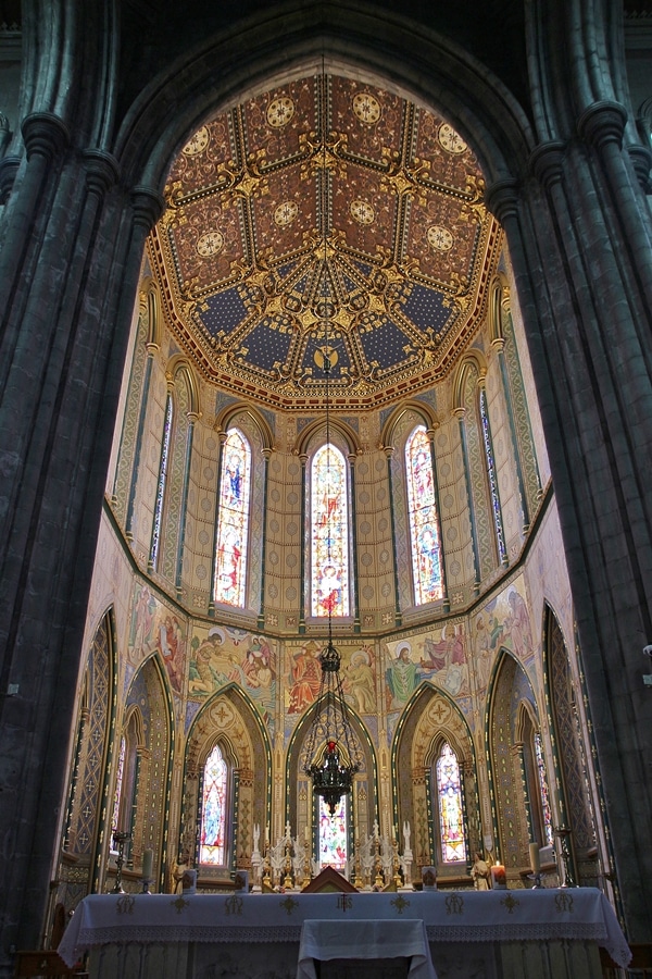 the altar in a church with tall ceilings