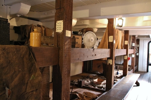 A large room lined with bunks