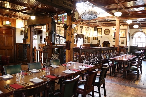 interior of a restaurant with long tables