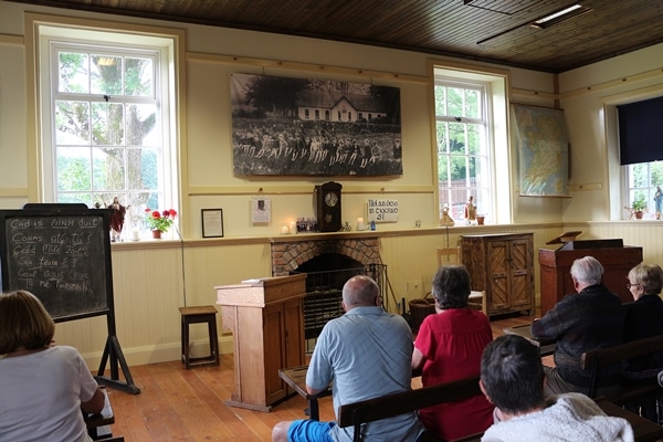 people sitting in an old classroom