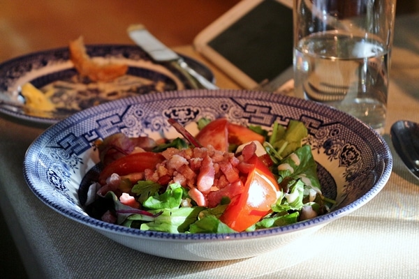 salad in a blue and white bowl