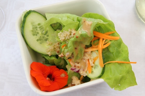 A bowl of salad with cucumbers