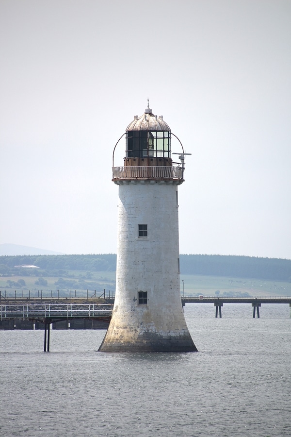 a lighthouse in the water