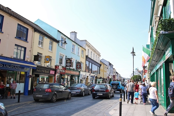 A group of people walking on a city street