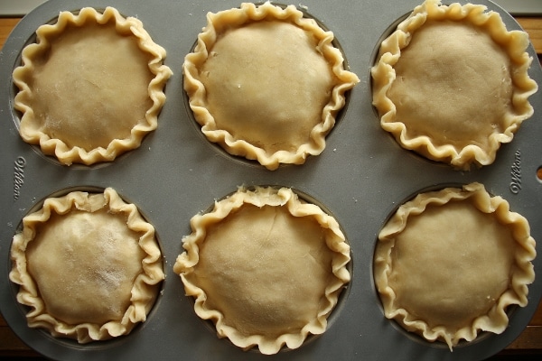 6 small pies assembled in a jumbo muffin pan