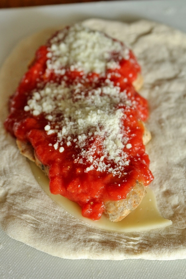 assembling a meatball calzone