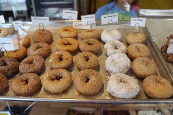 a tray of small donuts