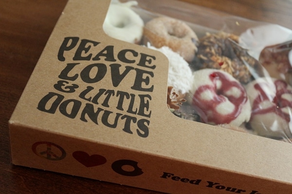 A close up of a box of donuts