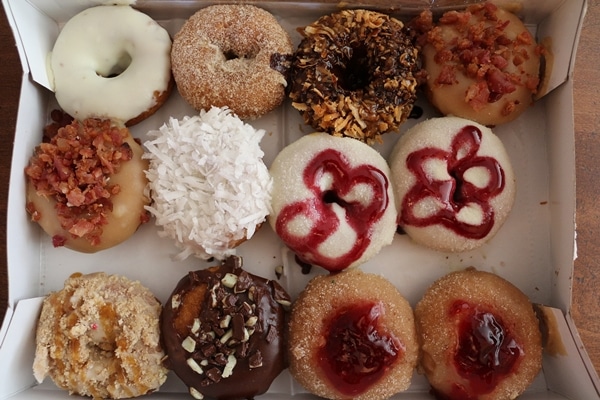 A box filled with different kinds of donuts