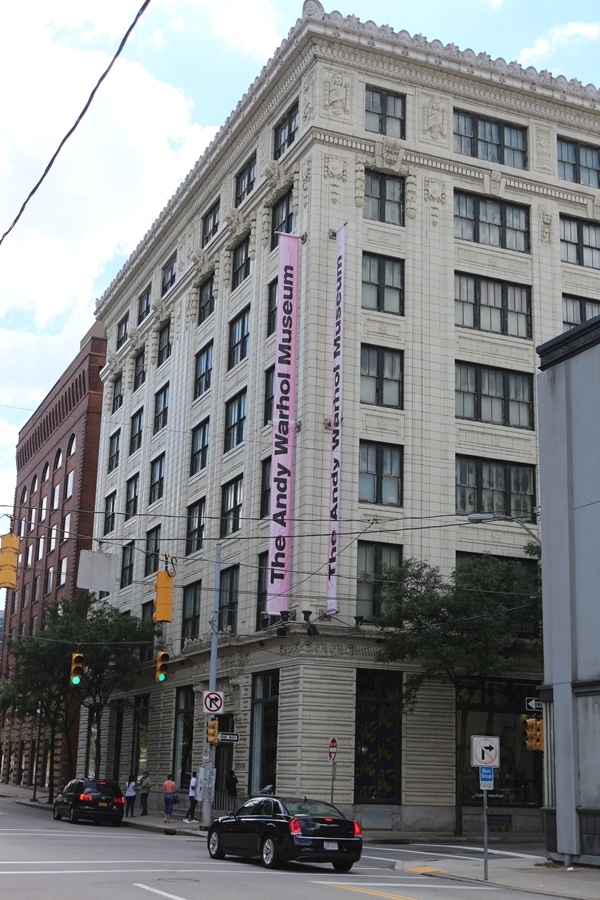 A city street in front of a tall building