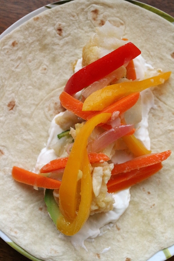 closeup of a fish taco with bell peppers