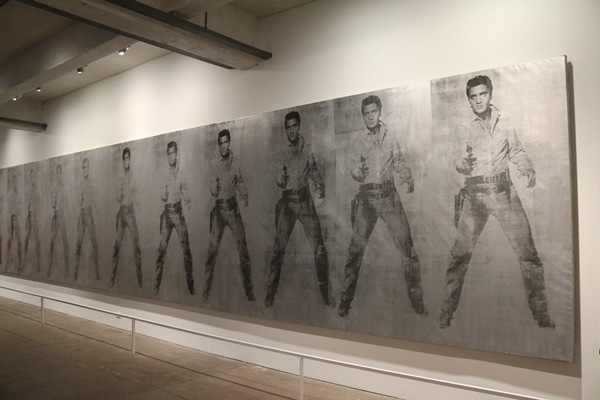 a row of paintings of Elvis Presley