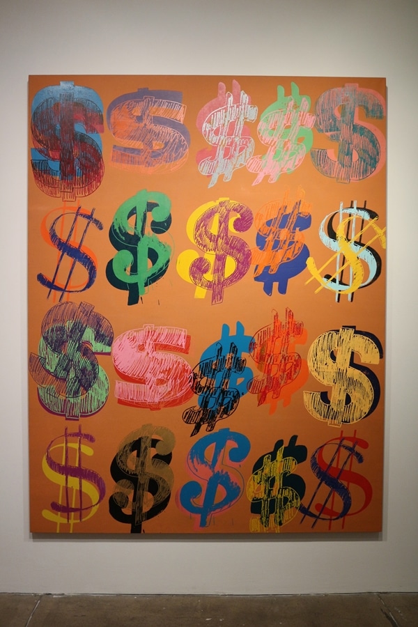 a painting of various dollar signs in different colors