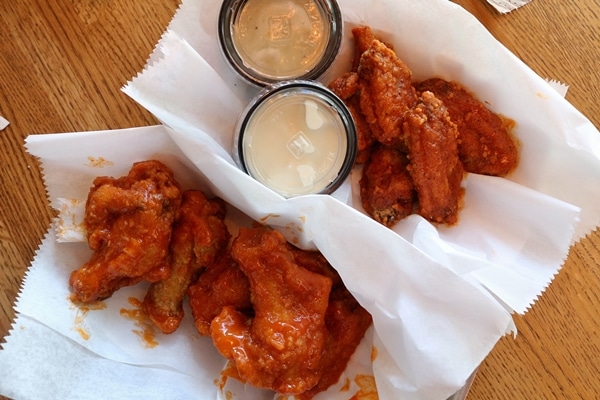 overhead view of 2 baskets of chicken wings