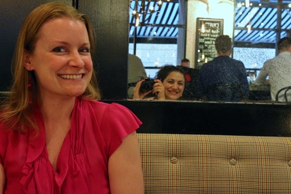 A woman sitting at a table in a restaurant