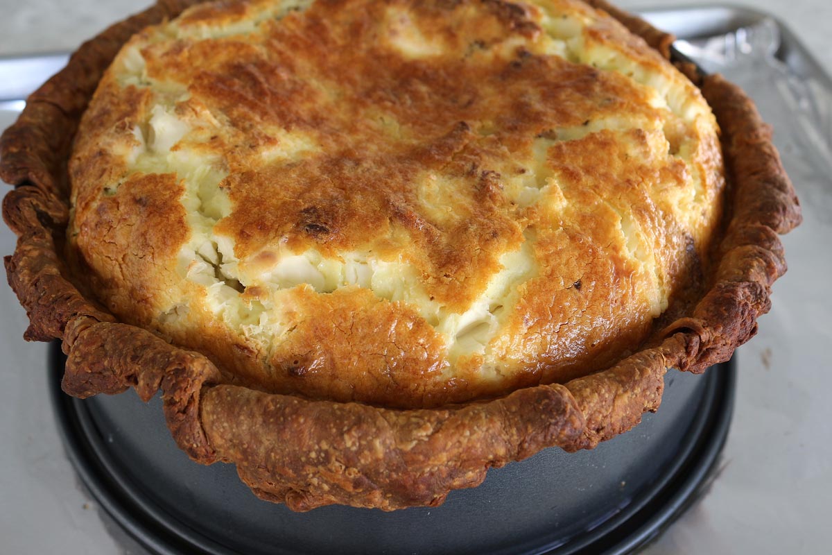 A puffed up quiche right out of the oven.