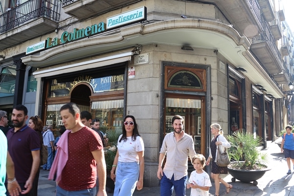 A group of people standing in front of a building