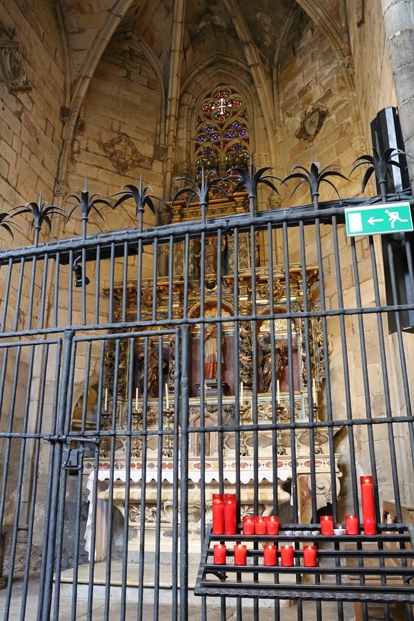 an altar behind a metal fence