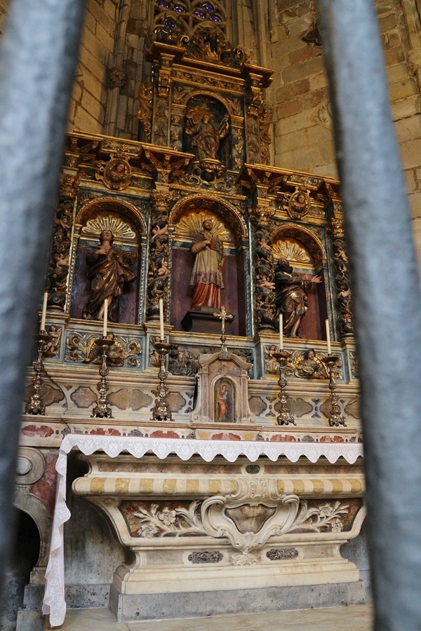 an altar through a metal fence