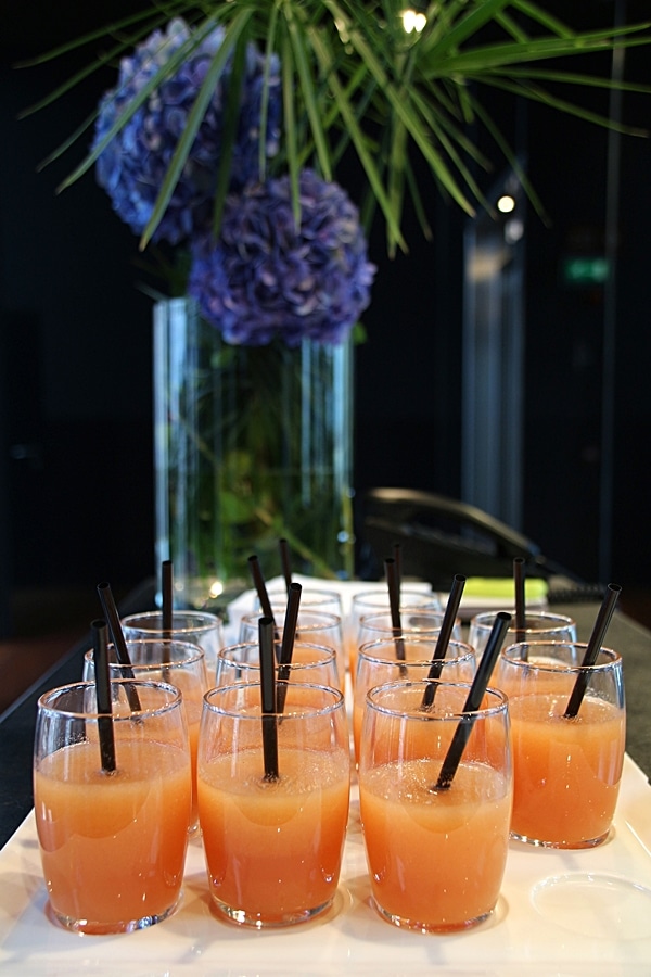 smoothies served in small glasses on a tray