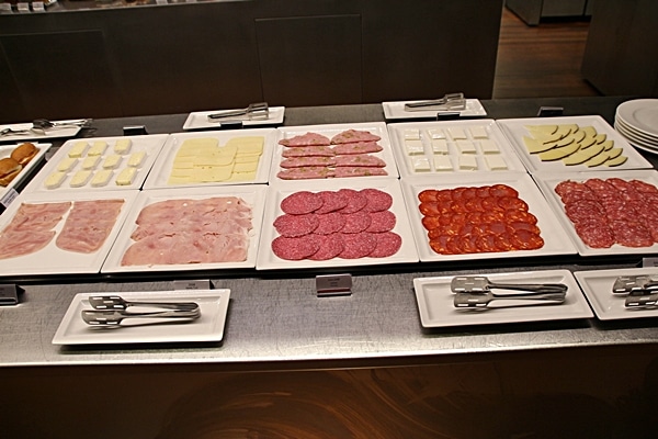 cured meats and cheeses on a buffet line