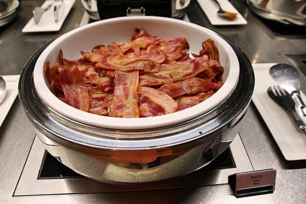 cooked bacon on a buffet line