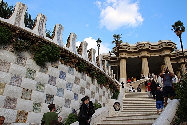 A group of people on a mosaic-lined stairway