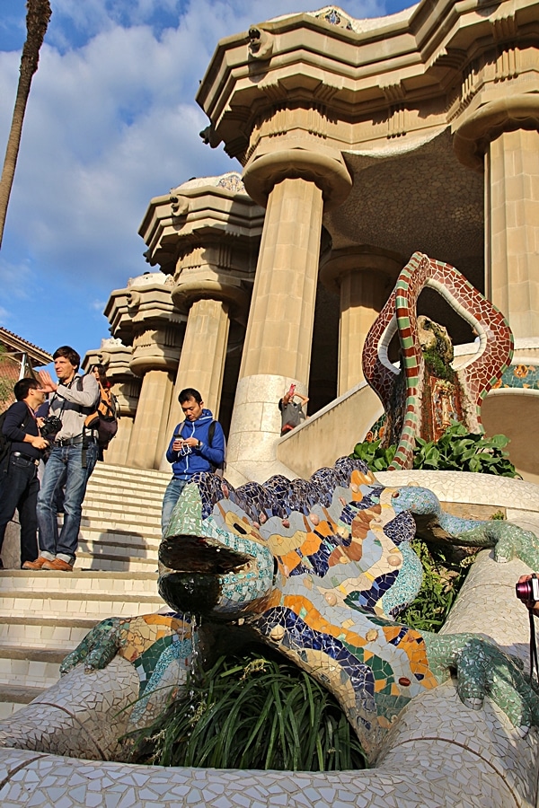 A group of people standing around a statue