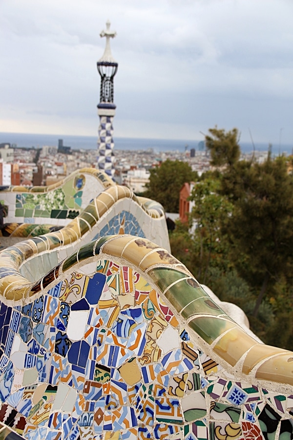 a closeup of mosaic covered benches in Park Güell