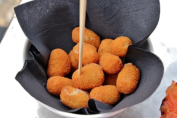 a dish of fried croquettes