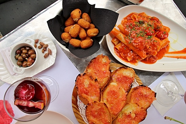 overhead view of a table covered in plates of food