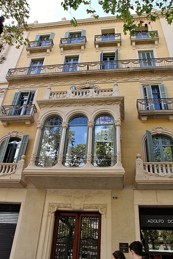 closeup of a yellow building with large windows