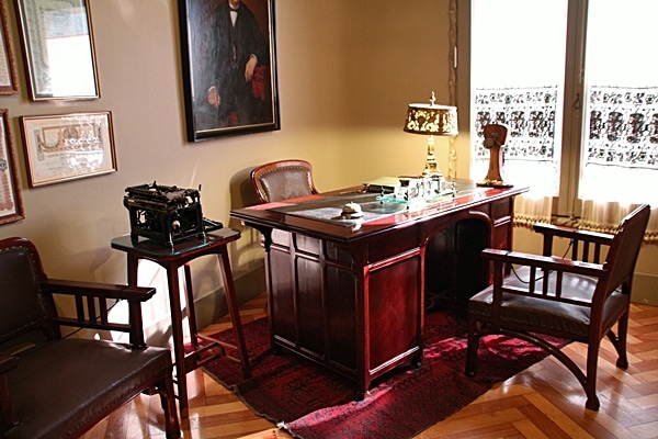 an office with a large wooden desk