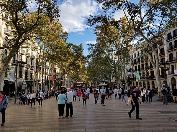 A group of people walking on Las Ramblas in Barcelona