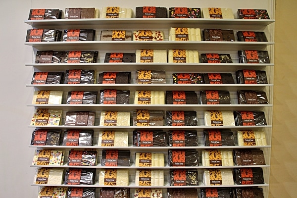 A close up of bars of chocolate on display for sale