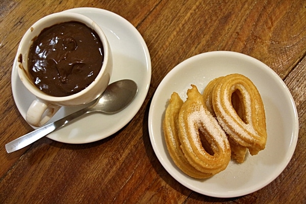 overhead view of churros and chocolate