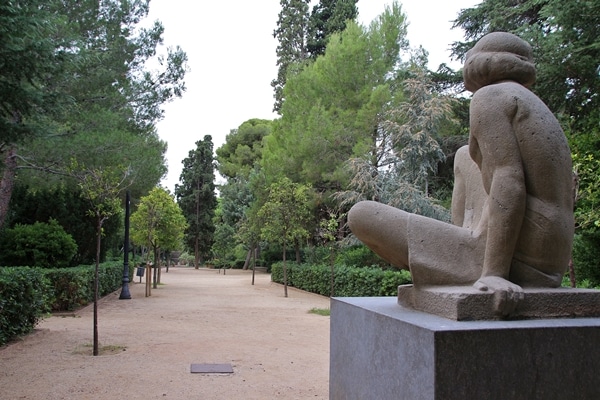 A large stone statue in a park