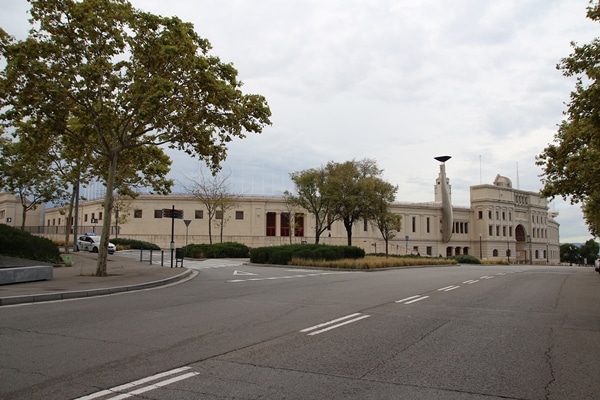 an Olympic stadium across an empty street