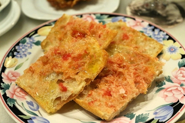 A piece of toasted bread rubbed with tomato