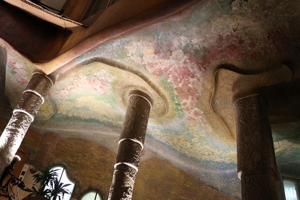 columns holding up a colorfully painted ceiling