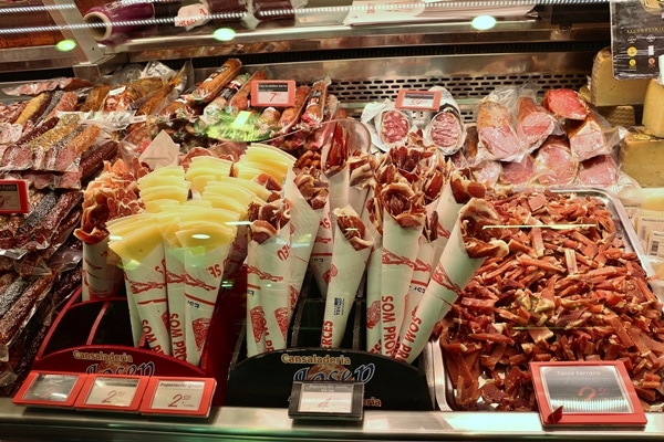 closeup of a display of cured meats and cheeses