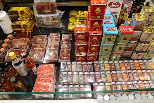 containers of spices in a market