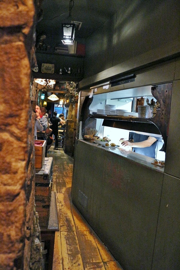 the opening to the kitchen in a small restaurant