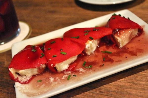 A plate of roasted red peppers stuffed with cheese