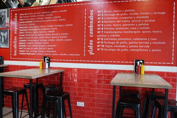 a menu on a red wall